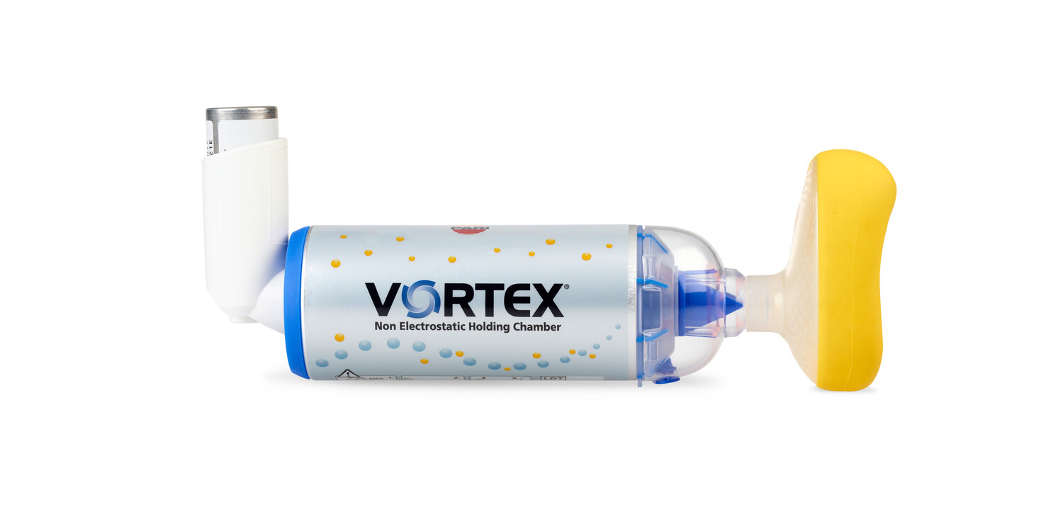 Vortex ikke-elektrostatisk holdekammer med inhalator og gul maske, brukt til astmabehandling.