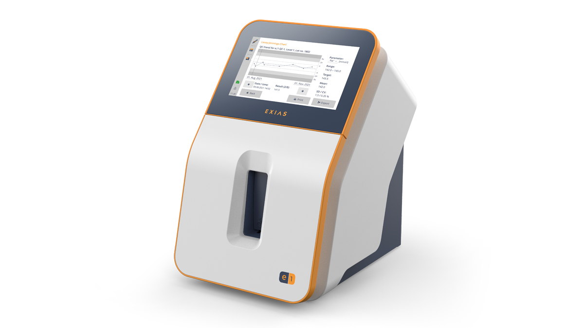 En moderne medisinsk enhet med berøringsskjerm som viser diagrammer og data, merket "EXIAS" på fronten.